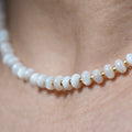Dreamtide Shore white iridescent glass bead choker necklace on skin, close-up detail, handcrafted in BC Canada