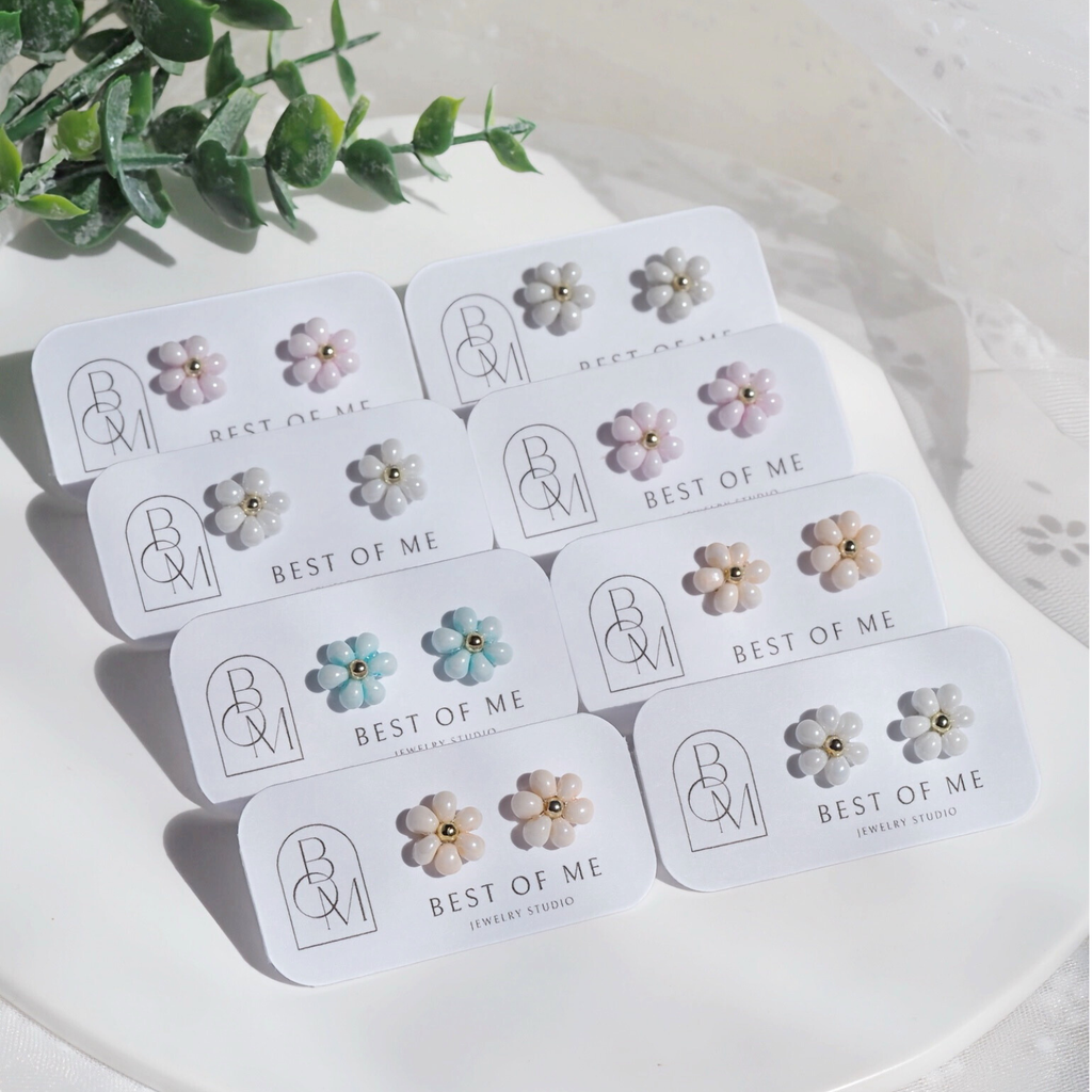 Set of handmade floral earrings on branded cards with 'Best of Me' branding.