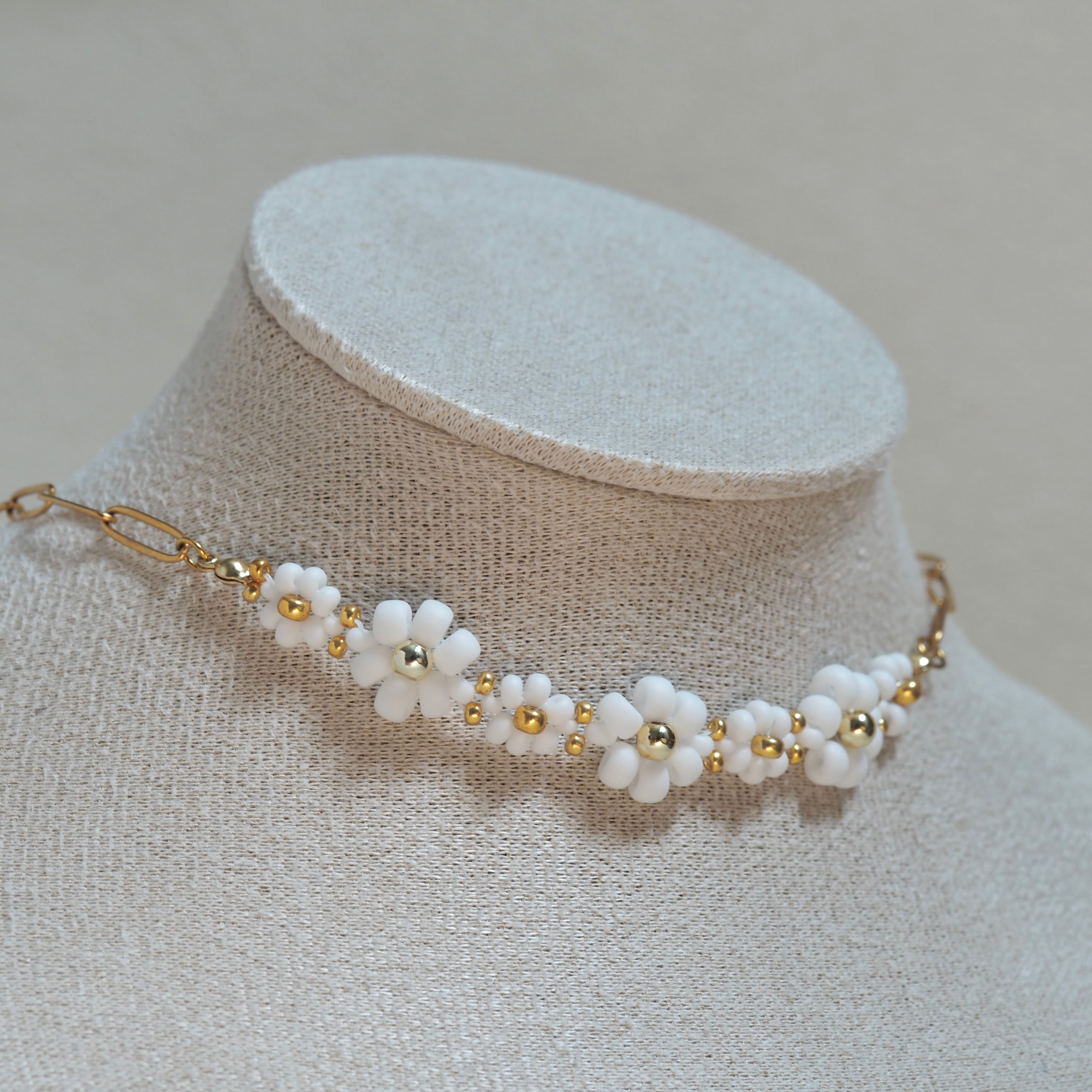 The Urban Petal white flower choker necklace on bust display, handcrafted in BC Canada