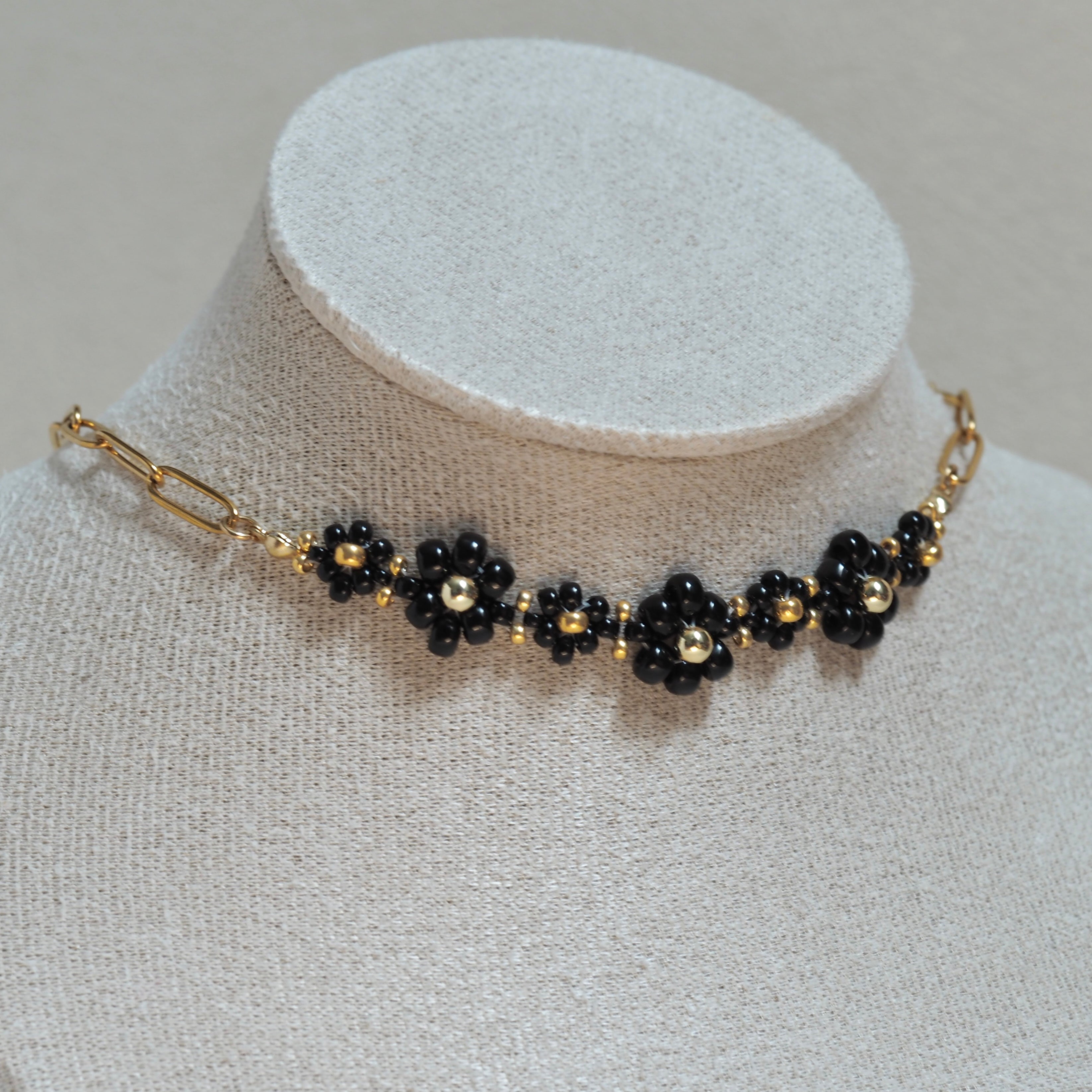 The Urban Petal black flower choker necklace on bust display, handcrafted in British Columbia Canada