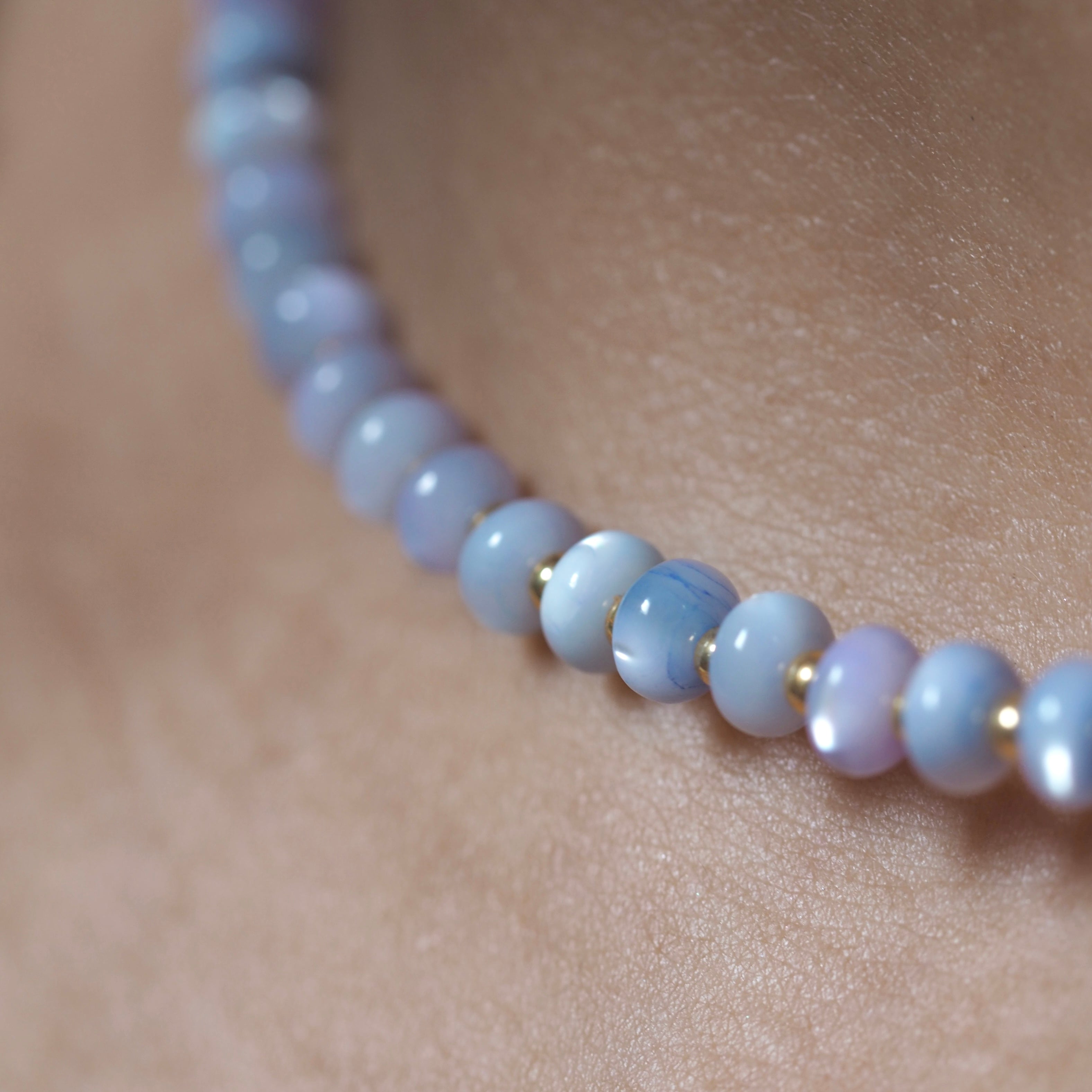 Dreamtide Tide blue violet iridescent glass bead choker necklace on skin, close-up detail, handmade jewelry Canada