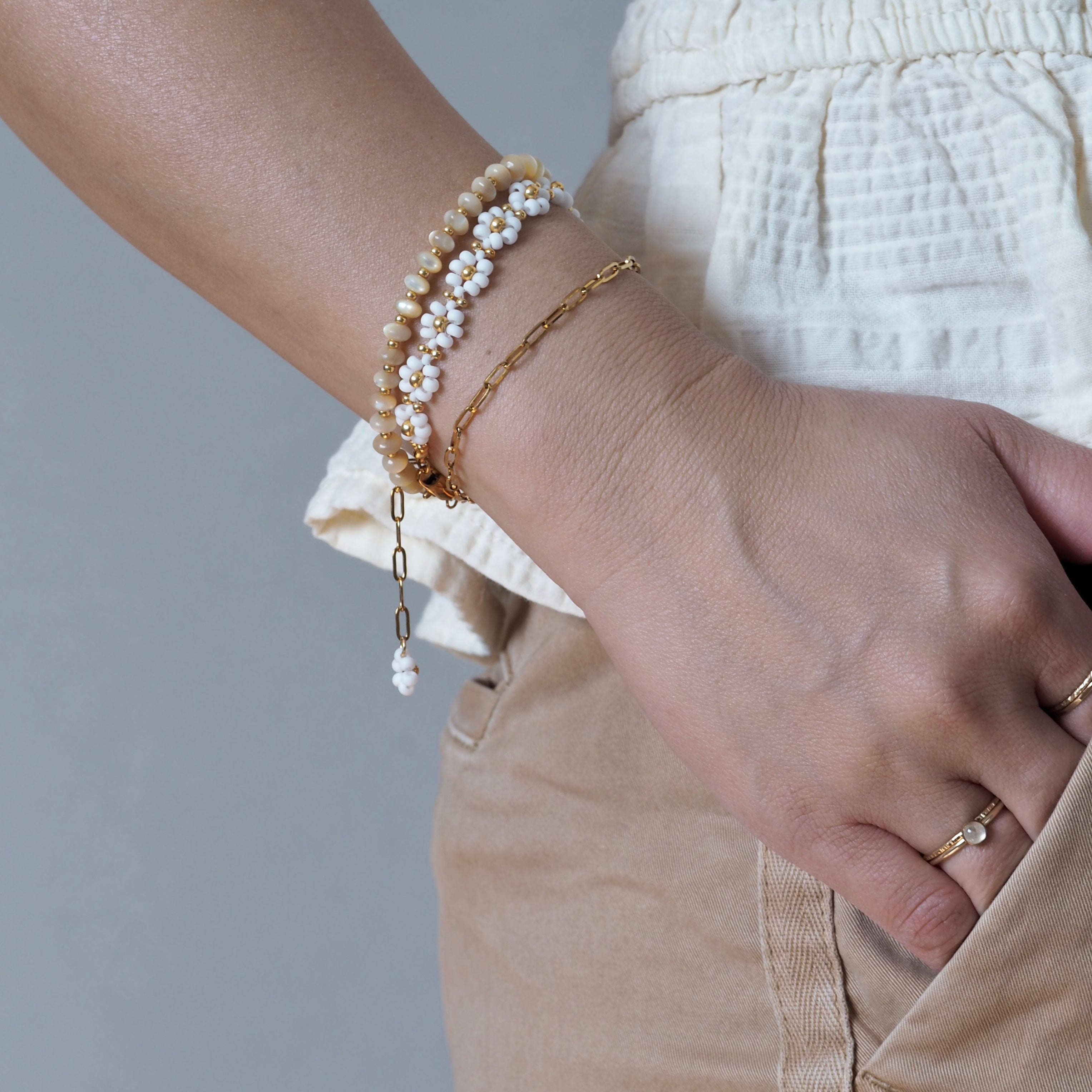 Dreamtide white glass bead bracelet stacked with gold chain bracelet, handcrafted in BC Canada