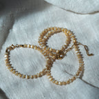 Dreamtide Dune beige glass bead choker necklace styling, handcrafted minimalist jewelry BC Canada