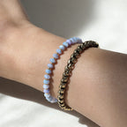 Dreamtide Tide iridescent glass bead bracelet stacked on wrist, minimalist jewelry Canada