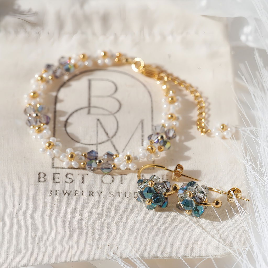 handmade elegant Jewelry set with bracelet and earrings on a Best of Jewelry Studio branded jewelry bag.